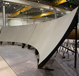 Shell plate in custom formed jigs to verify precise field fit Shell plate in custom formed jigs to verify precise field fit